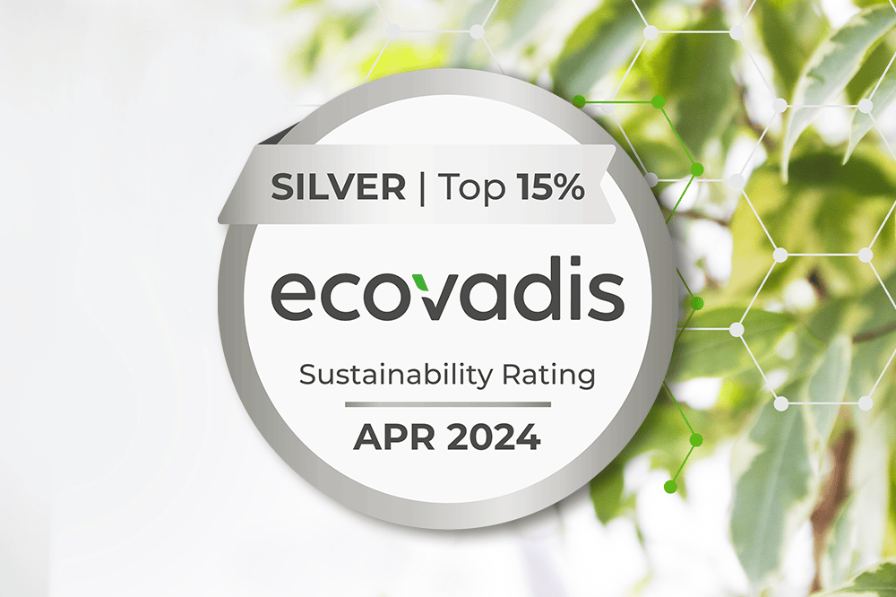 ecovadis April 2024 top 15% silver rating logo in front of blurred leaves