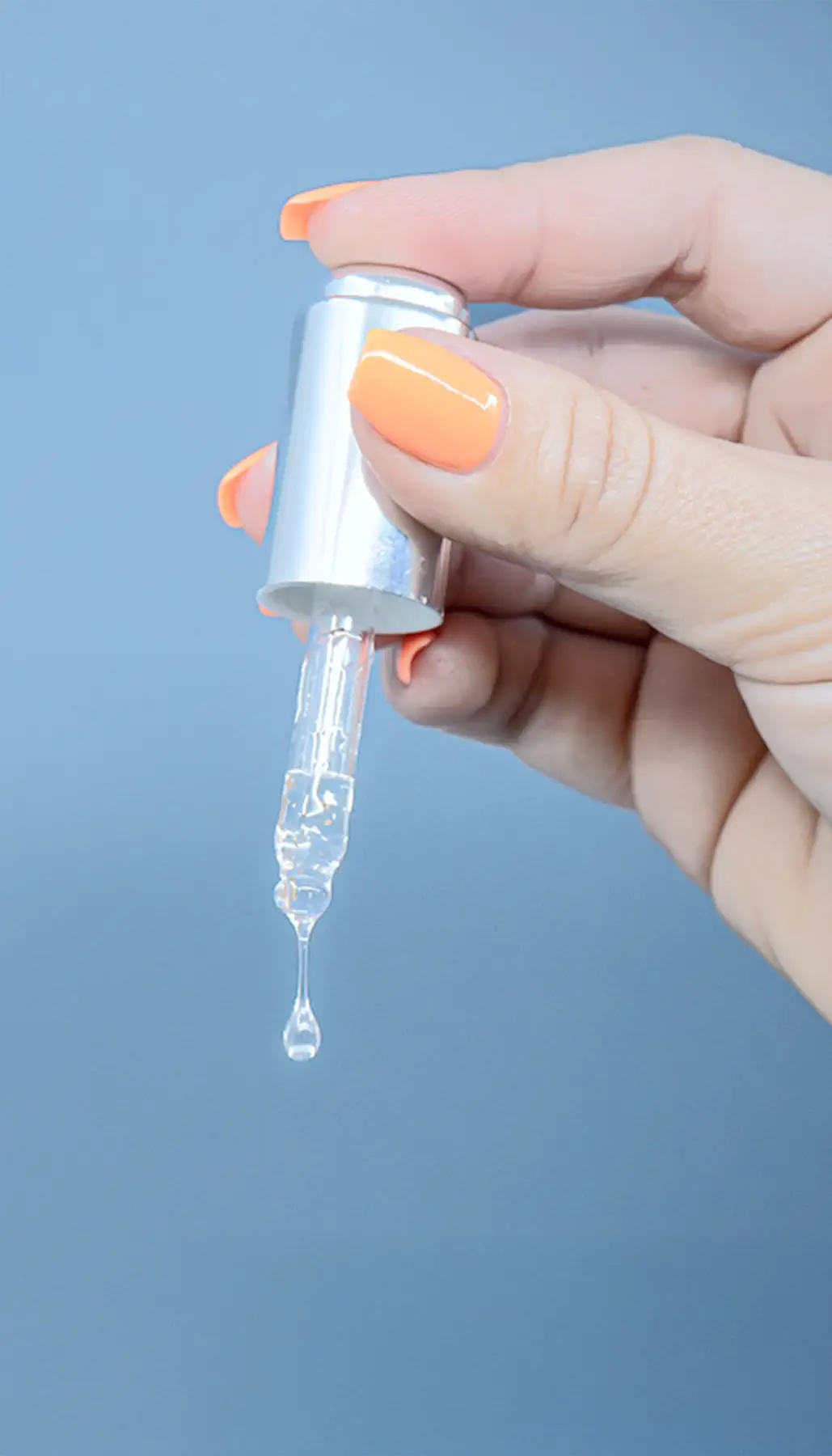 Female hand with eyedropper